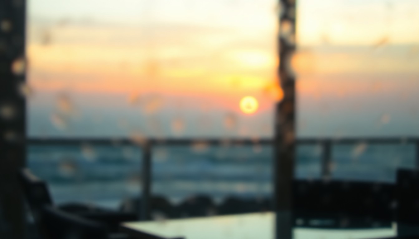 An extremely abstracted, out-of-focus photograph shot through condensation or rain-streaked glass, capturing the soft, warm glow of an oceanfront balcony at sunset, with blurred silhouettes of patio furniture and the distant horizon visible through the hazy glass.