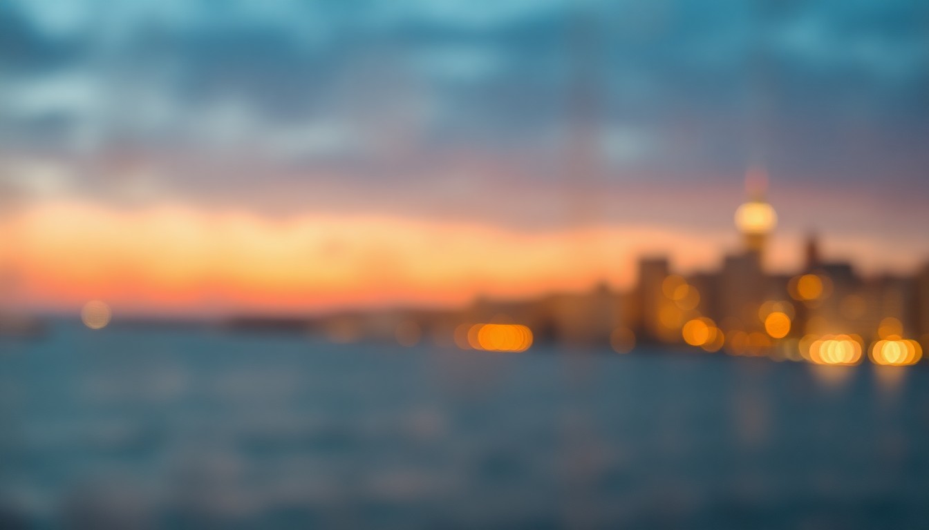 An abstract, impressionistic photograph of a coastal city skyline at dusk, with blurred, glowing lights reflecting off the water, conveying a sense of atmospheric transition and change.