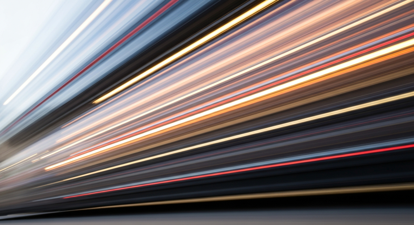 An abstract, blurred image of a moving vehicle, conveying a sense of speed, modern engineering, and the dynamic nature of the automotive industry.