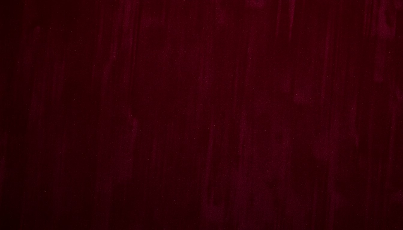 An abstract close-up photograph of a plush, high-contrast velvet texture in deep burgundy and charcoal grey, conveying the luxurious and intimate nature of a long-term celebrity relationship.