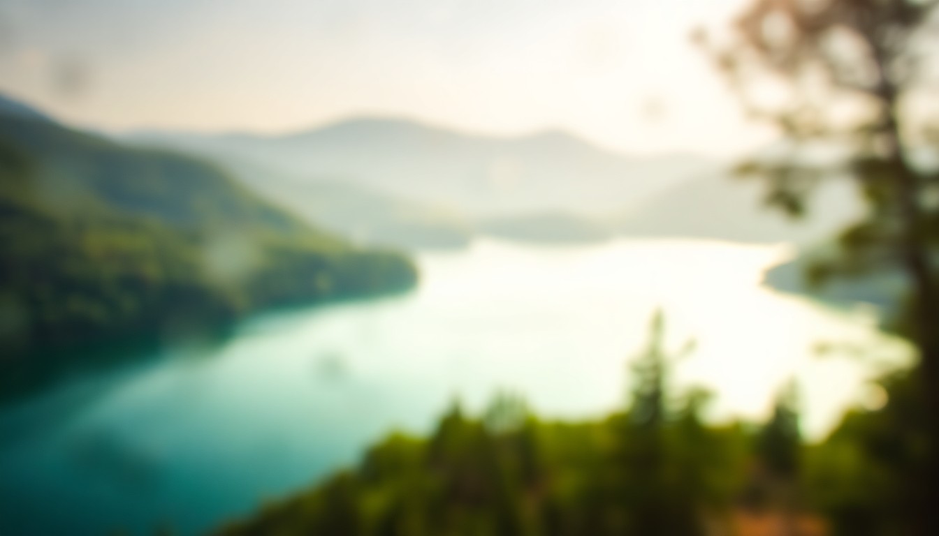 An extremely blurred, dreamlike scene of a lake surrounded by hazy, verdant hills, with the water's surface reflecting the warm, golden light of the sky above.