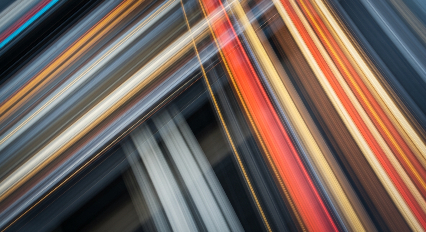An abstract, blurred image of a vehicle in motion, conveying a sense of speed and modern engineering through sweeping streaks of color.
