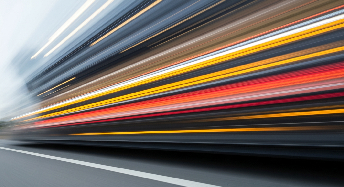 An abstract, blurred image of a vehicle in motion, conveying a sense of speed, energy, and the chaos of the fuel price crisis impacting Australian families.