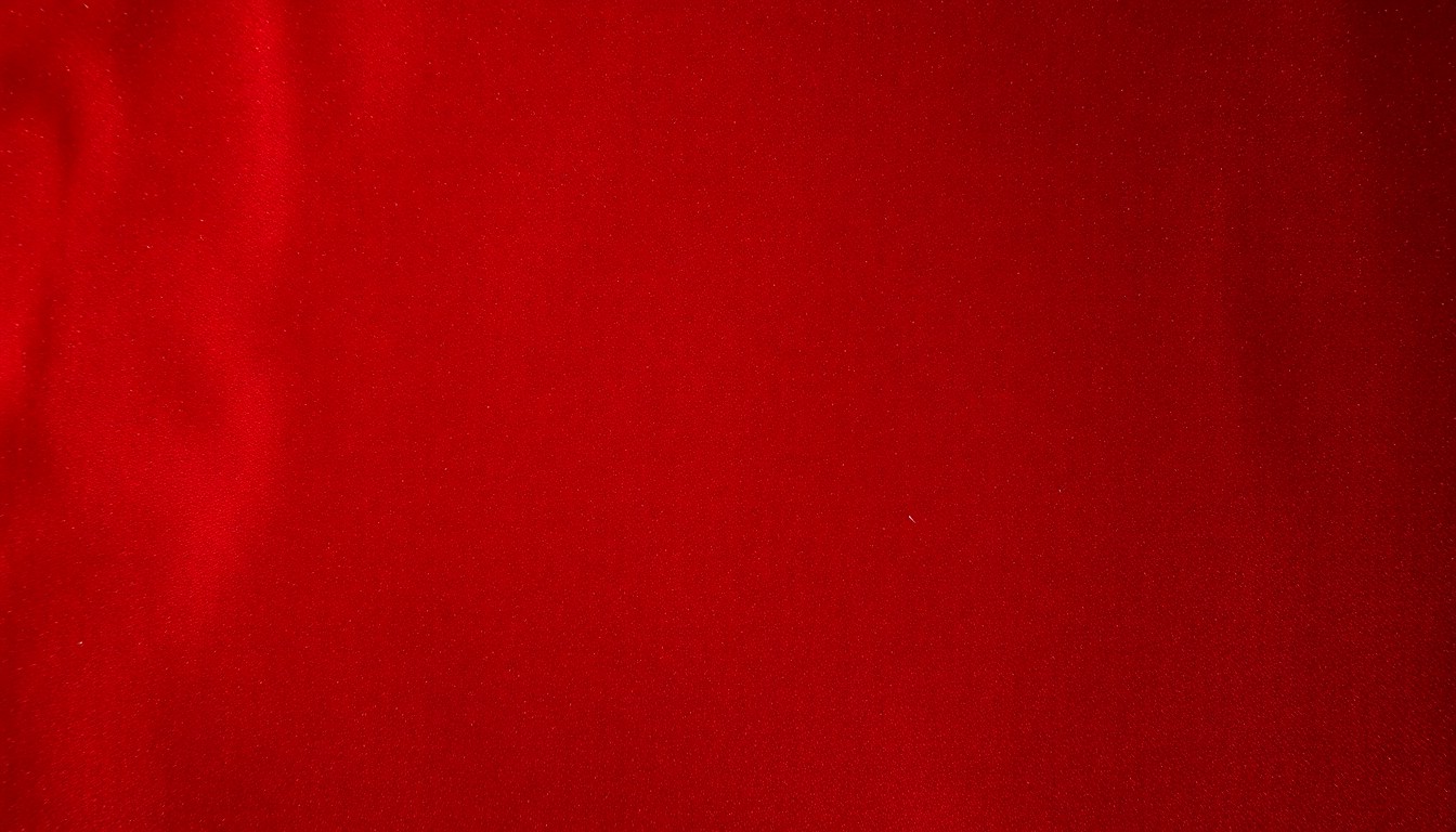 An extreme close-up photograph of a luxurious burgundy and gold velvet fabric, capturing the rich, textured essence of Hollywood's golden age in an abstract, conceptual manner.