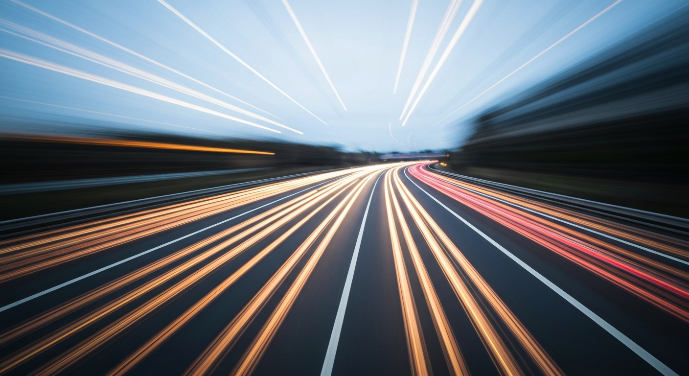 An abstract, blurred scene of a highway in motion, with vibrant streaks of color and movement conveying the energy and speed of the road work.