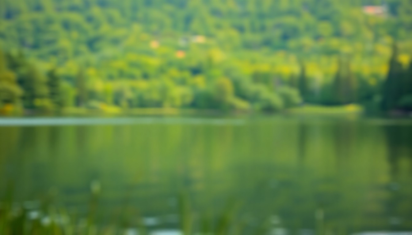 An abstract, impressionistic photograph of a lake surrounded by trees, with soft, blurred pools of warm light and color creating a serene, atmospheric scene.