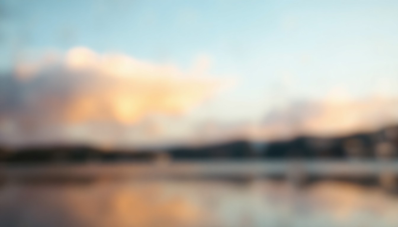 An abstract, impressionistic scene of soft, blurred colors and light, evoking the tranquil atmosphere of a lakeside park setting.