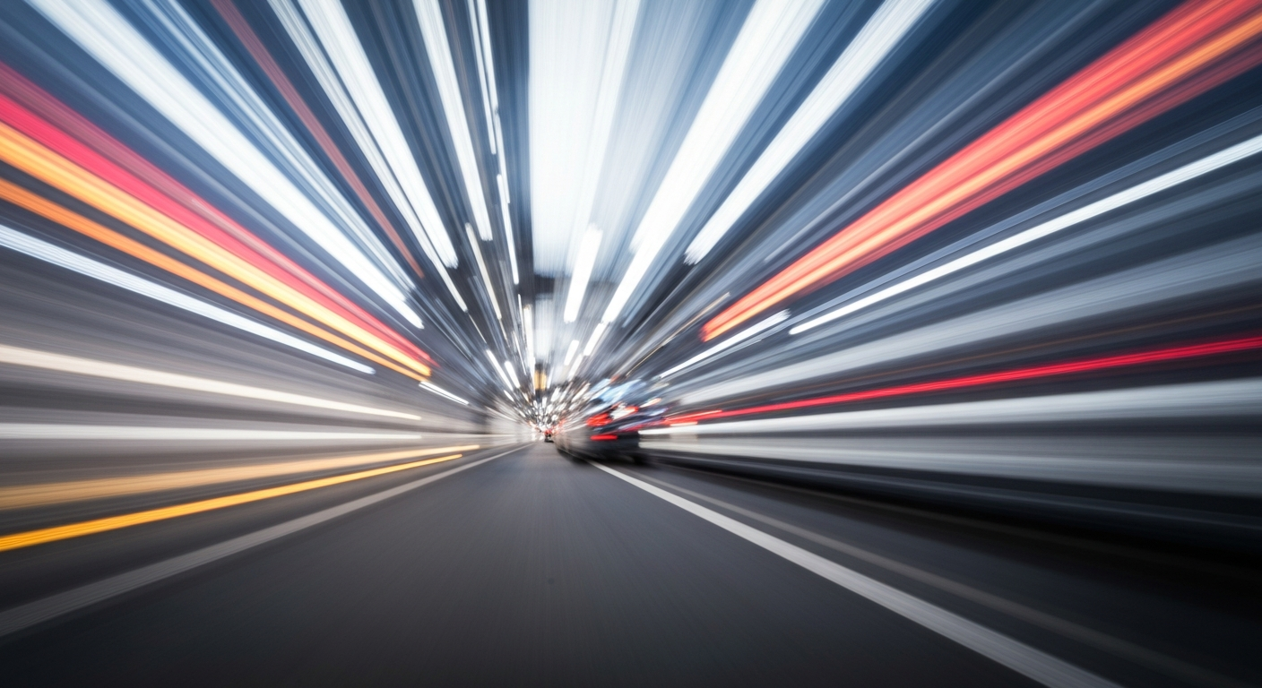 An abstract, blurred image of a moving vehicle, with streaks of vibrant color and a sense of speed and modern engineering.