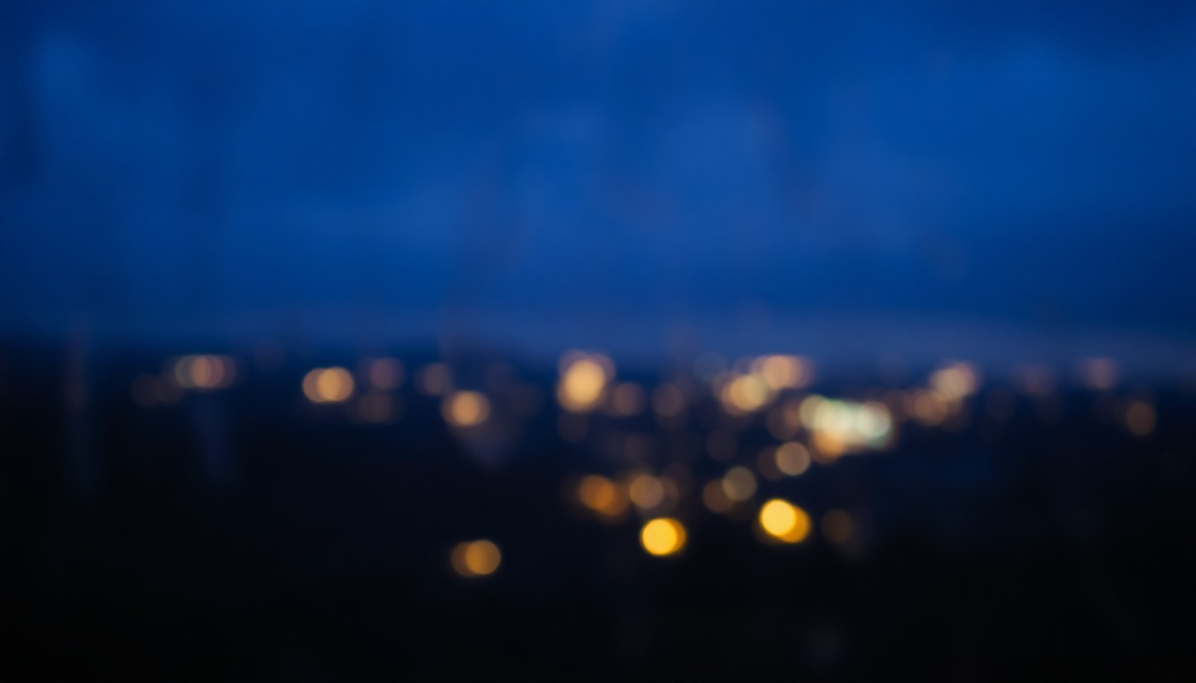 An abstract, dreamy landscape scene with soft, blurred lights in the distance, conveying a sense of mystery and the beauty of the unknown.