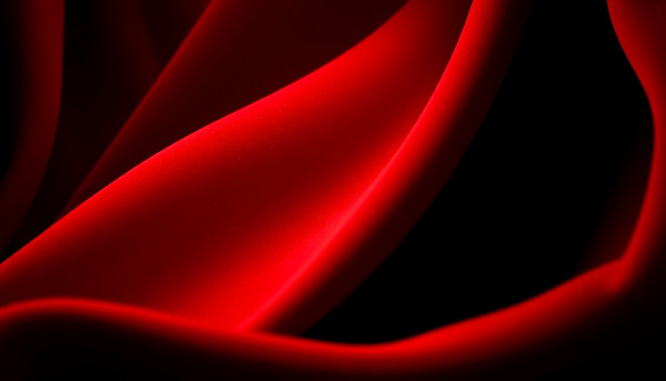 An extreme close-up photograph of rich, red velvet fabric with dramatic, high-contrast lighting, capturing the luxurious texture and glamour of the entertainment industry.