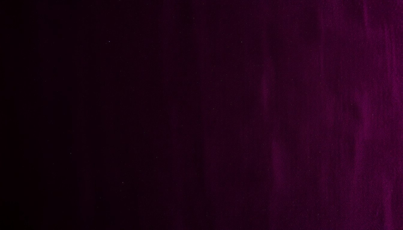 An abstract close-up photograph of a plush, velvety fabric in deep, saturated shades of navy and burgundy, conveying the luxurious and glamorous nature of celebrity real estate.