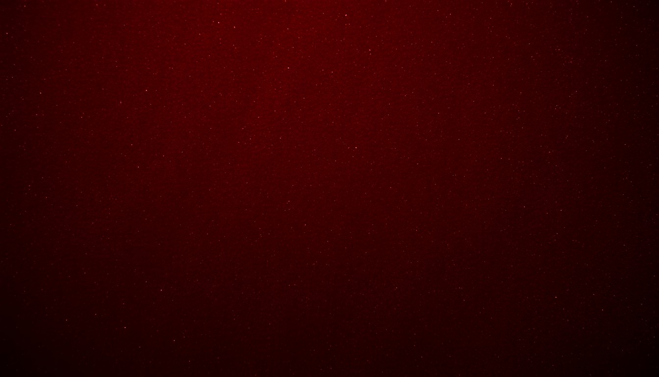 An abstract, high-contrast close-up photograph of a lush, velvety burgundy texture, capturing the glamour and elegance of the INK Festival's tribute performance honoring the life and work of Gavin Petrie.