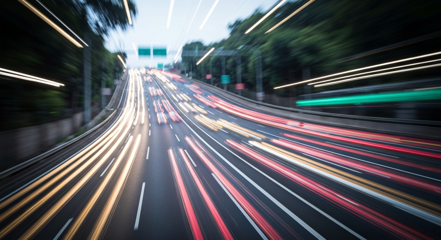 A dynamic, abstract image of a busy highway reduced to streaks of color and motion, conveying the chaos and disruption of the upcoming lane closures and ramp shutdowns on the I-405.