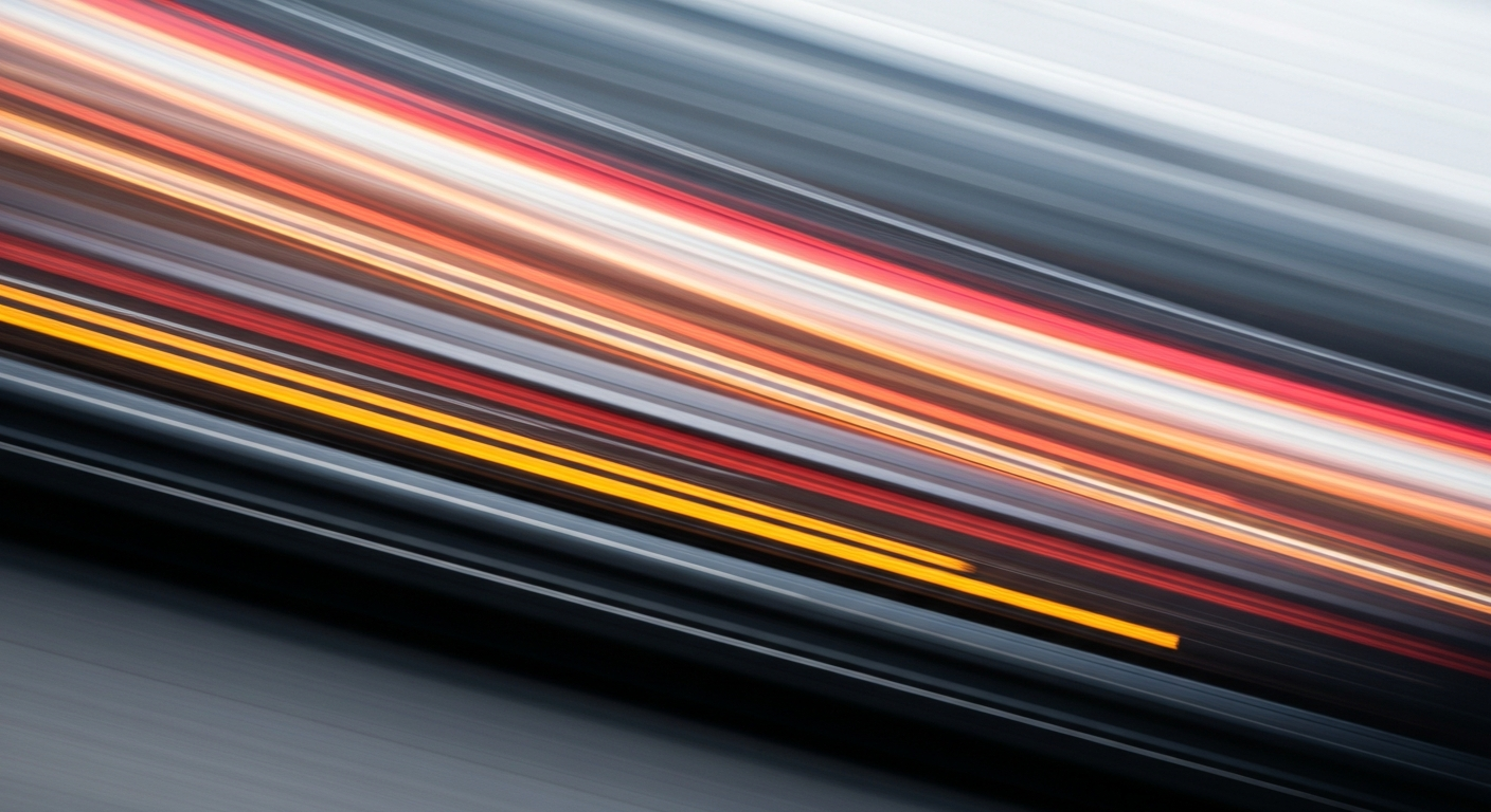 An abstract, blurred image of a vehicle in motion, represented as sweeping brushstrokes of color, conveying the speed and modern engineering of the automotive industry.