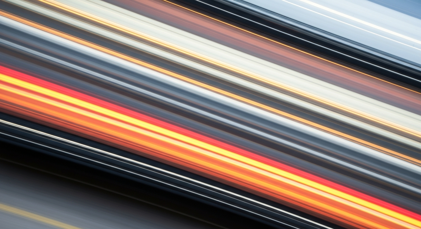 An abstract, sweeping image of a vehicle in motion, rendered as vibrant streaks of color and blurred shapes, conveying the energy and urgency of safe driving practices.