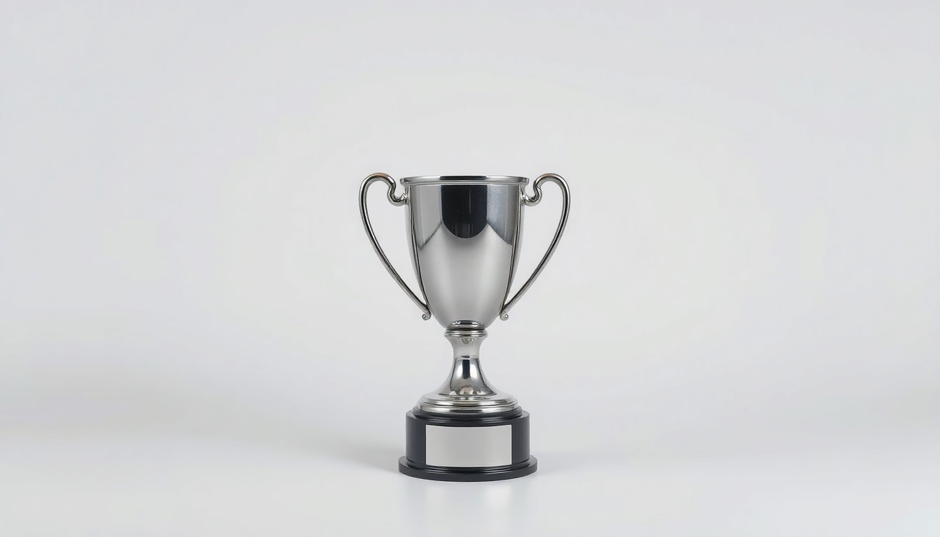 A photorealistic studio still-life image featuring a shiny metal trophy or award on a clean, minimalist background, symbolizing Pelham's economic achievement of having the lowest unemployment rate among major cities in the state.