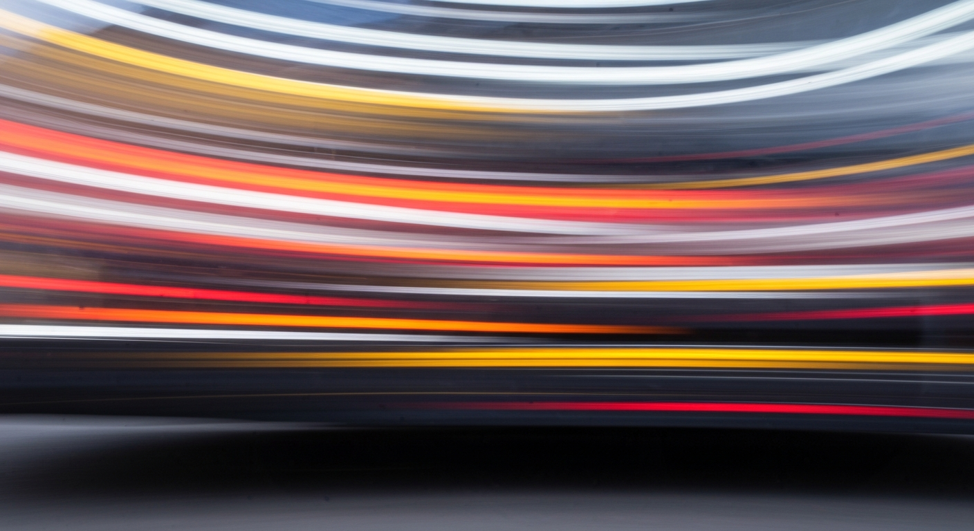 An abstract, colorful image created through a slow-shutter, panning camera technique, depicting a vehicle in motion as sweeping, blurred streaks of color, conveying the dynamic and evolving nature of the finance industry.