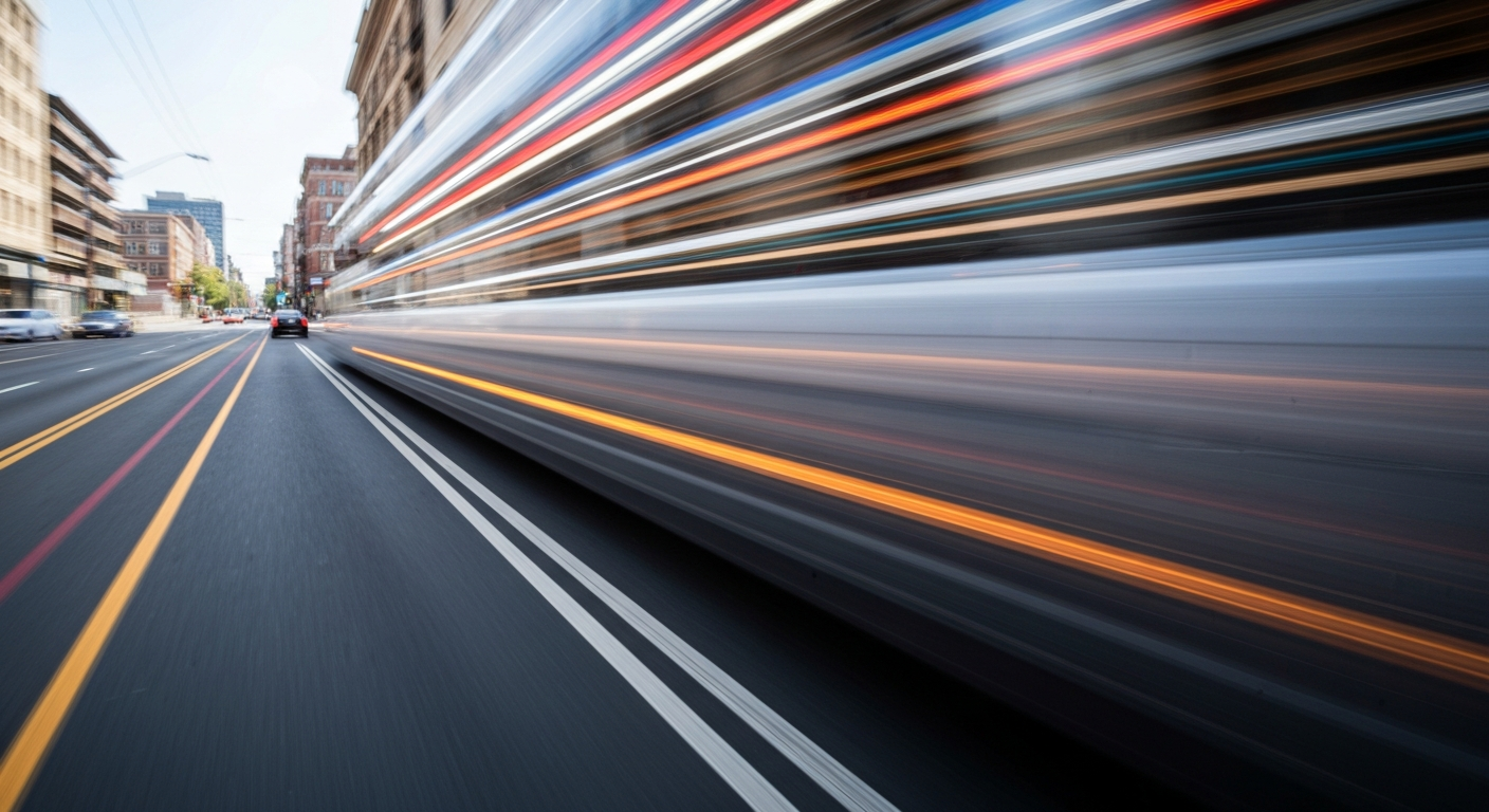 An abstract, blurred image of a car in motion on a city street, with vibrant streaks of color representing the sense of change and transition in the surrounding area.