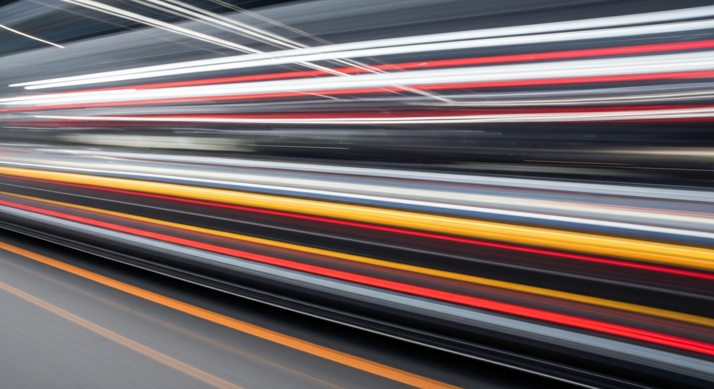 Heavily blurred, sweeping streaks of bright colors representing the motion of a vehicle, conceptually illustrating the dynamic nature of the automotive industry and the role of car service ramps.