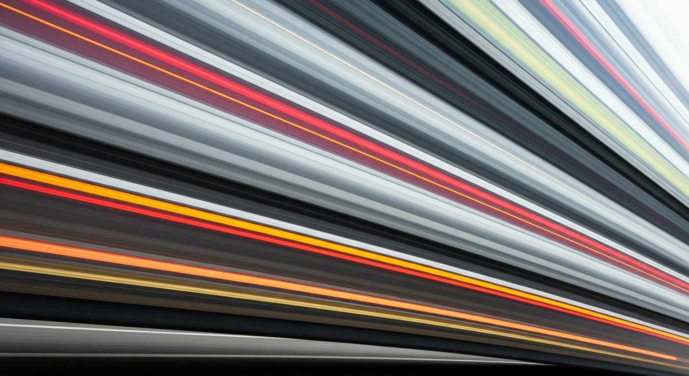An abstract, blurred image of a moving vehicle, conveying a sense of speed, modern engineering, and the dynamic nature of automotive technology.